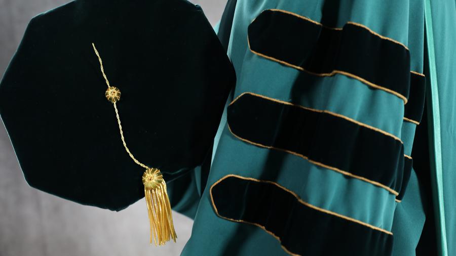 Cap and gown for a PhD graduate.