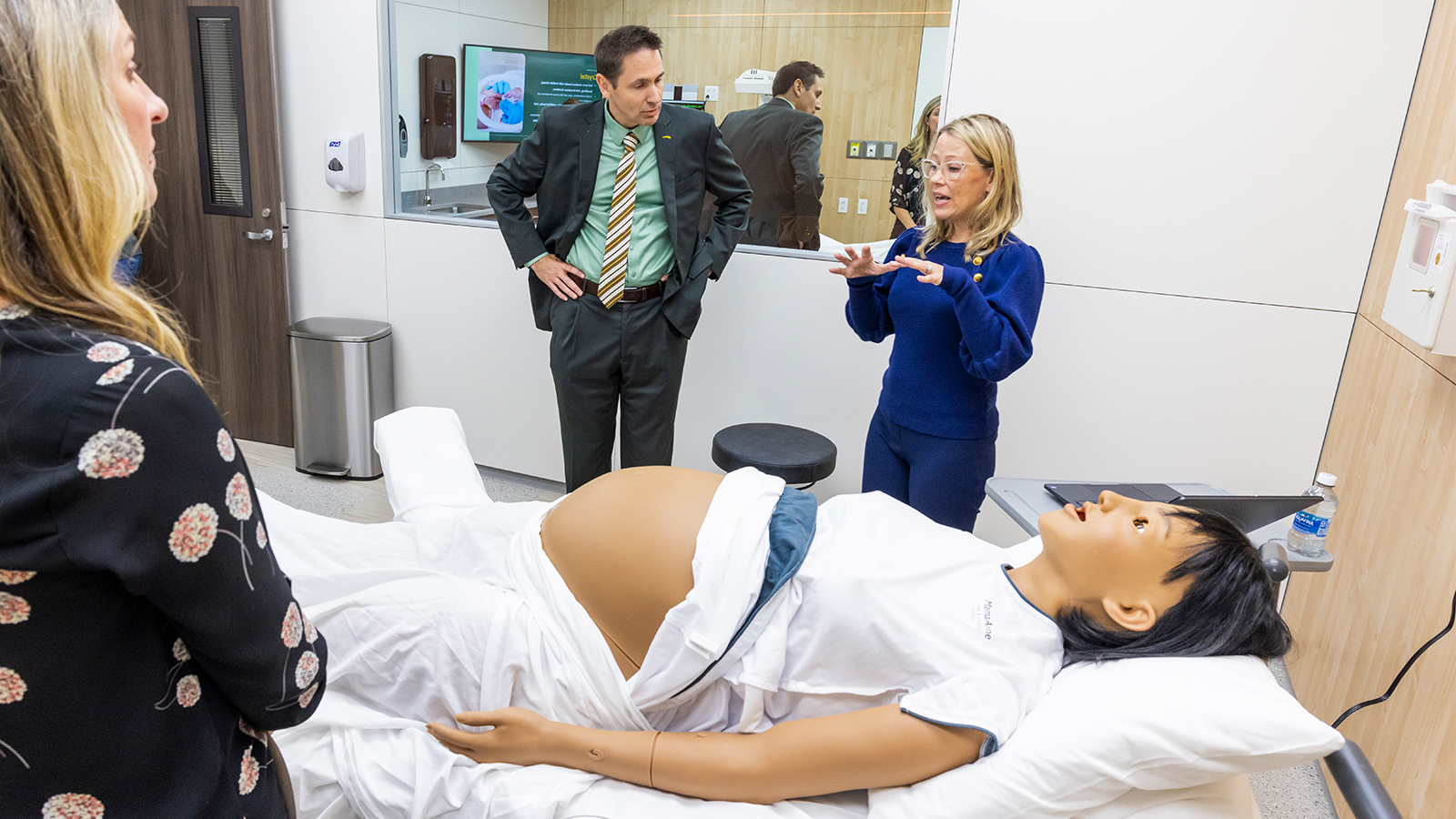 Baylor University faculty learn about a high-fidelity manikin that can simulate pregnancy.