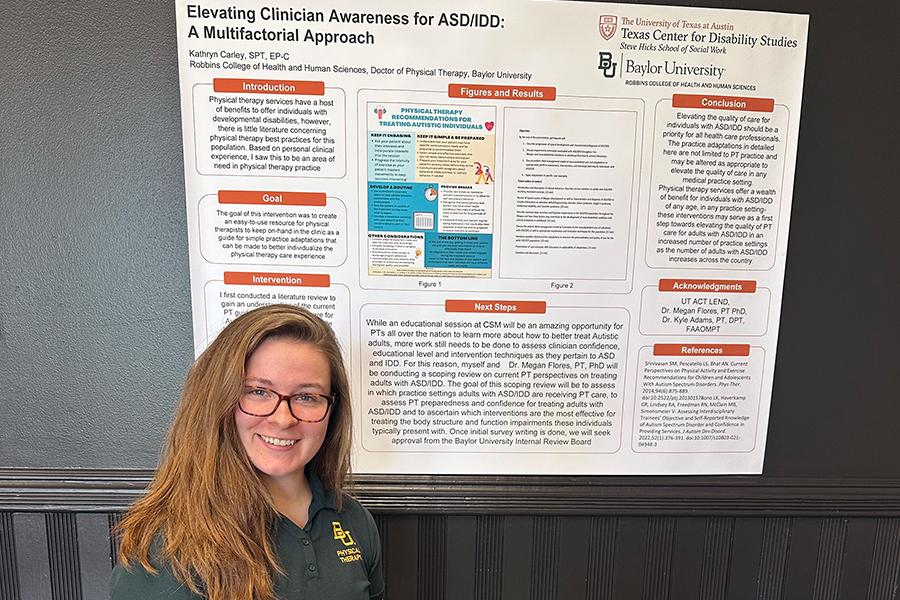 Recent DPT graduate, Kathryn Carley, poses in front of her ACT LEND poster presentation. 