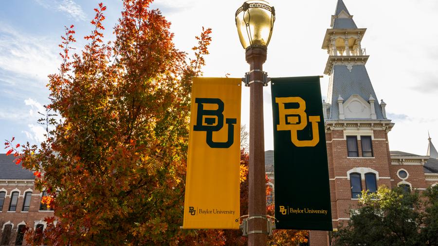 "BU" banners hang on a lampost on Baylor University's campus.